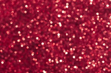 Soyut kırmızı arka plan. Kırmızı renklerde parlak glitter bokeh.
