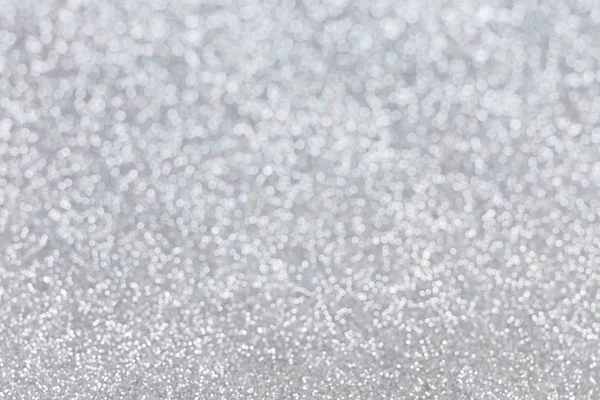 Abstract silver glitter background. Sparkle silver bokeh christmas background.