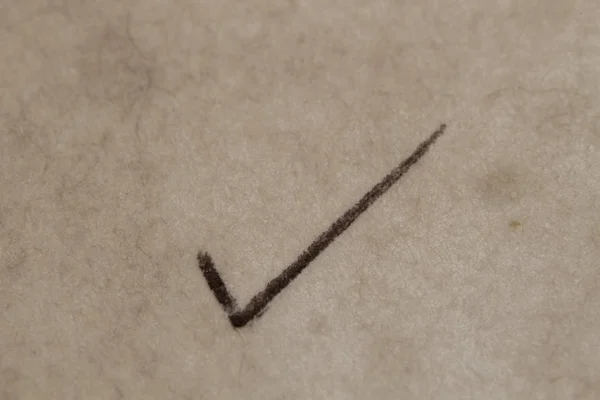 Check mark handwriting on the old paper