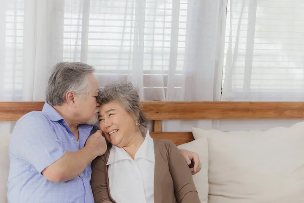 Asian happy retired senior smiling cute eldery couple enjoying & laughing dancing together in home. Romantic relationship of lovely & beautiful marriage lover with happiness lifestyle after retirement