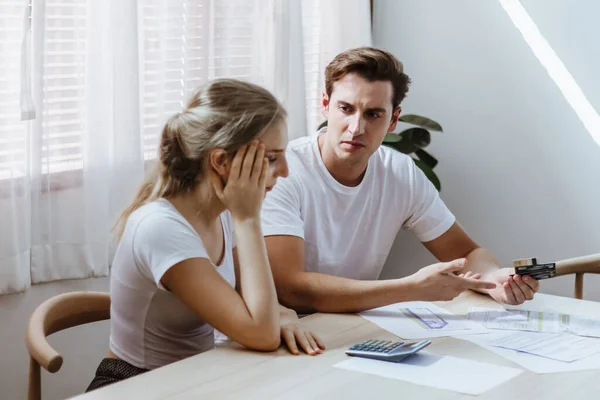 Stressed & unhappy caucacian couple conflict of credit card bills or debt of over expense in shopping. Depressed & worry lover financial crisis problem of no money to pay loan lead to bankruptcy