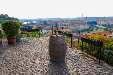 Prague, Czech Republic - August 25, 2018: Picturesque and romantic view over the Prague with a bottle of wine