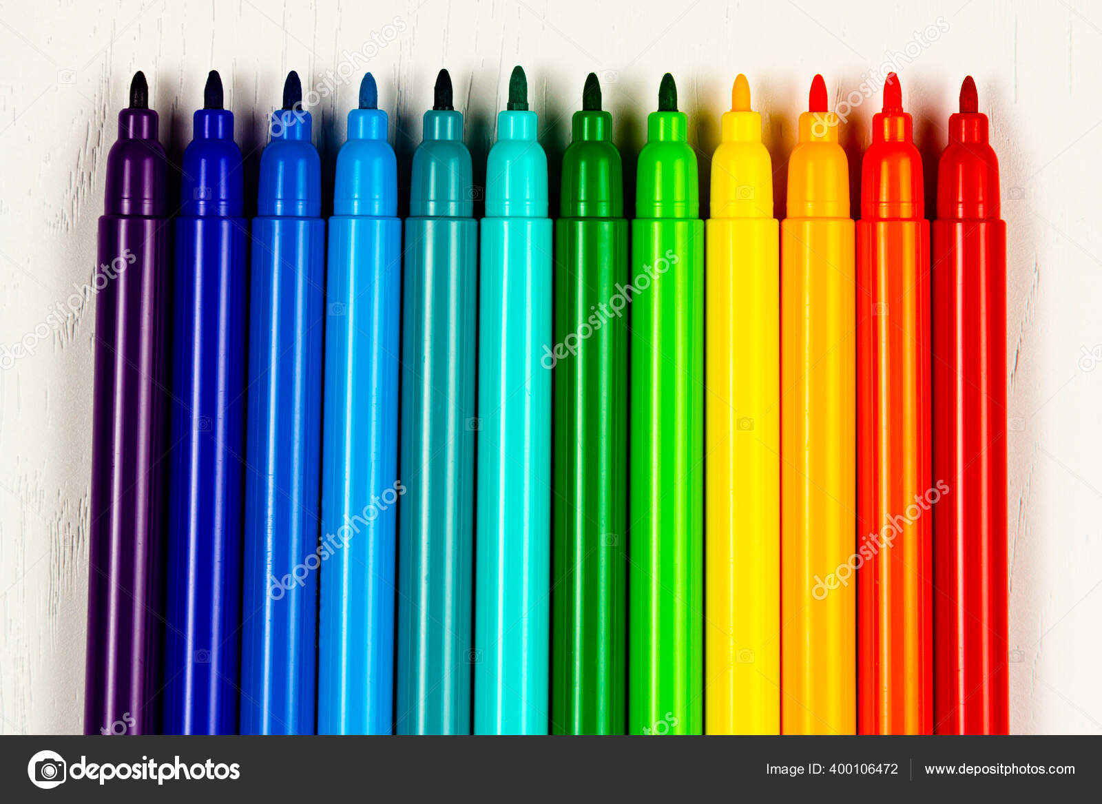 Bright Colored Markers Caps Lie White Wooden Table Stock Photo by  ©av_antropov 400106472