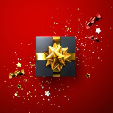 Parlak altın fiyonklu siyah hediye kutusu ve köpüklü konfetiyle kurdeleler