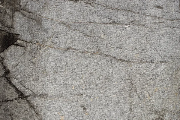 粗糙的纹理石材表面有裂缝 — 图库照片