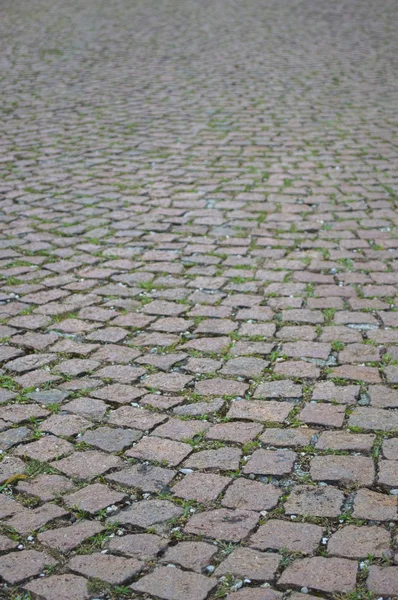 Surface of old colorful square paving stones