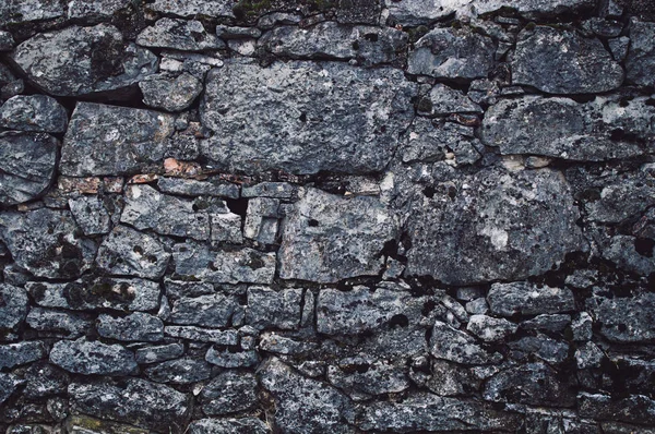Vägg av strukturerade grova stenblock — Stockfoto