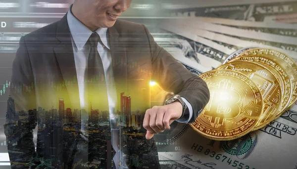 Double exposure of businessman using the tablet with Bitcoin exchange of trading screen on Closeup Bitcoins mockup on the money paper bank of various country, crypto currency and investment concept