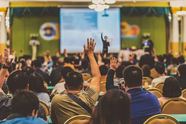 Rear View Audience Showing Hand Answer Question Speaker Stage Conference — Stock Photo, Image