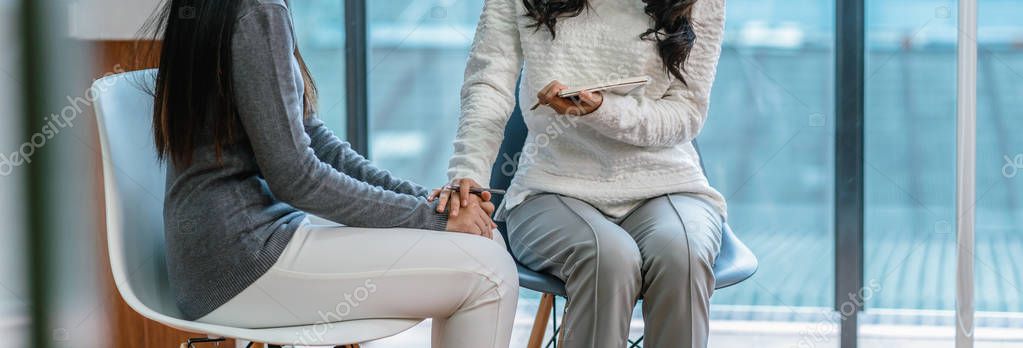 Banner of Asian woman professional psychologist doctor giving the consult to female patients in modern living room of house or hospital exam room, Mental health Concept