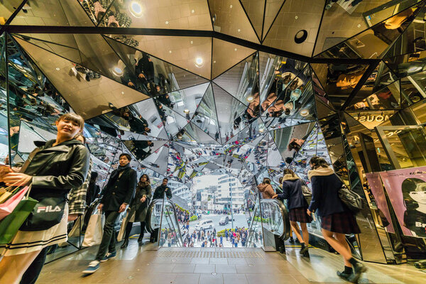TOKYO, JAPAN - FEB 2019 : Many Undefined foreign tourist visiting The Omotesando Tokyo Plaza building in Harajuku area on Febuary 16, 2019, Tokyo, Japan. Tokyu Plaza Omohara is a fashion shopping mall