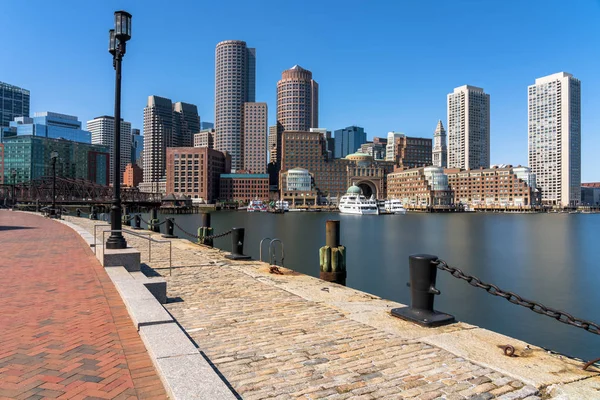 Scene of Boston skyline from Fan Pier at the afternoon with smooth water river, Massachusetts, USA downtown skyline, Architecture and building with tourist concept