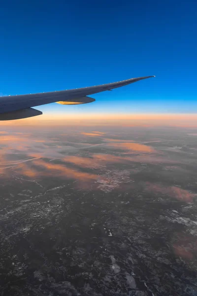 Out side above view from airplane side windows when sunrise, transportation and traveler concept