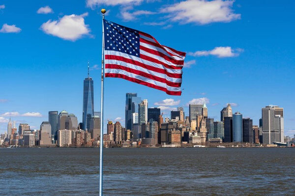 Scene of Flag of America over New york cityscape river side which location is lower manhattan,Architecture and building with tourist and Independence day concept