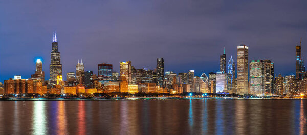 Panorama of Chicago Cityscape river side along Lake Michigan at beautiful twilight time, Illinois, United States, Business Architecture and building with tourist concept