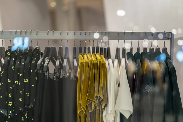 clothes line in glasses shop at shopping department store for shopping , business fashion and advertisement concept