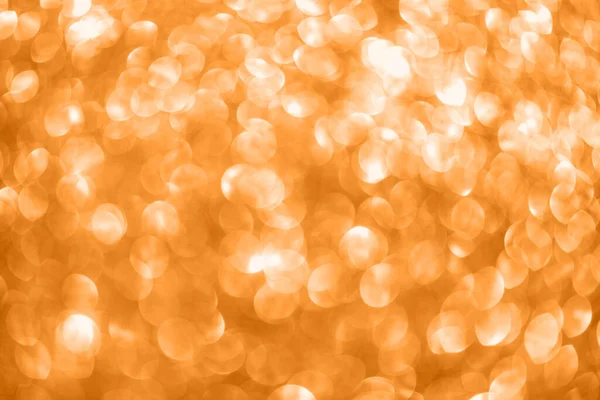 Golden orange bokeh abstract light defocused background. — Stock Photo, Image