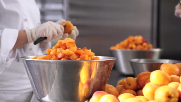 Hands Pastry Chef Cutting Apricots Prepare Jam Industrial Kitchen Worktop — Stock Video