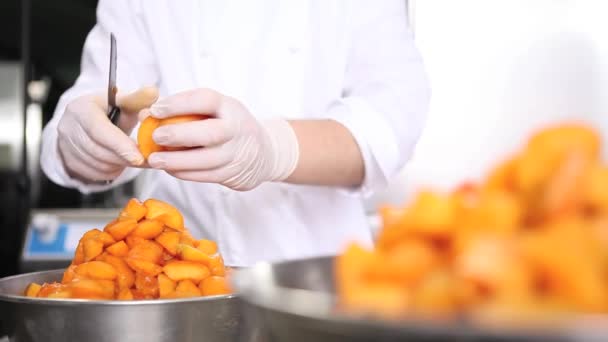 Hands Pastry Chef Cutting Apricots Prepare Jam Industrial Kitchen Worktop — Stock Video