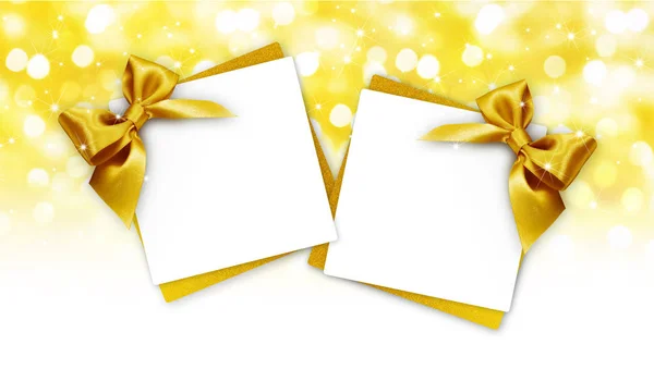 ゴールデン リボン弓分離された黄金色のぼやけたライト クリスマス背景に付いているギフトカード — ストック写真