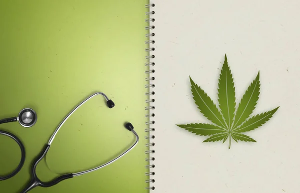 Maconha símbolo conceito médico, páginas de papel notebook com steth — Fotografia de Stock