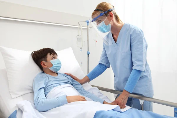 Nurse Takes Care Patient Child Hospital Bed Wearing Protective Masks — Stock Photo, Image