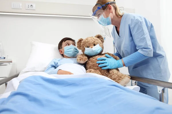 Nurse Takes Care Patient Child Hospital Bed Playing Teddy Bear — Stock Photo, Image