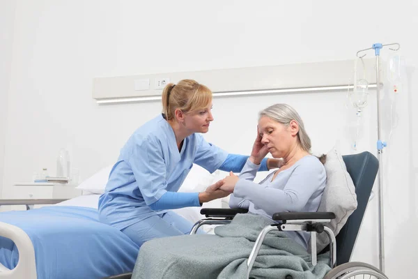Nurse Take Comfort Sad Pensive Elderly Woman Isolated Wheelchair Bed — Stock Photo, Image