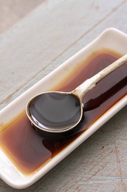 Worcestershire sauce in the plate clipart