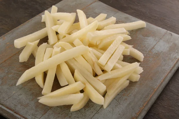 Uncooked Chipped Potatoes Table — Stock Photo, Image