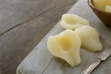 preparing peeled pears on the table clipart