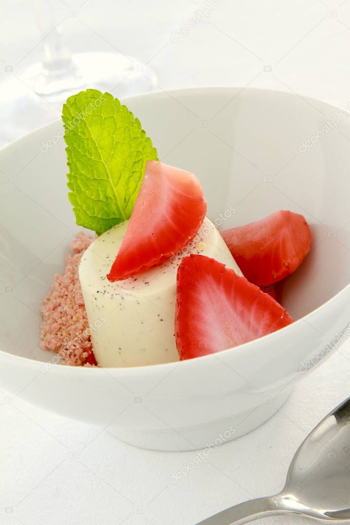 vanilla panna cotta dessert with strawberries