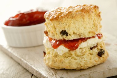 fresh baked scones with jam  clipart