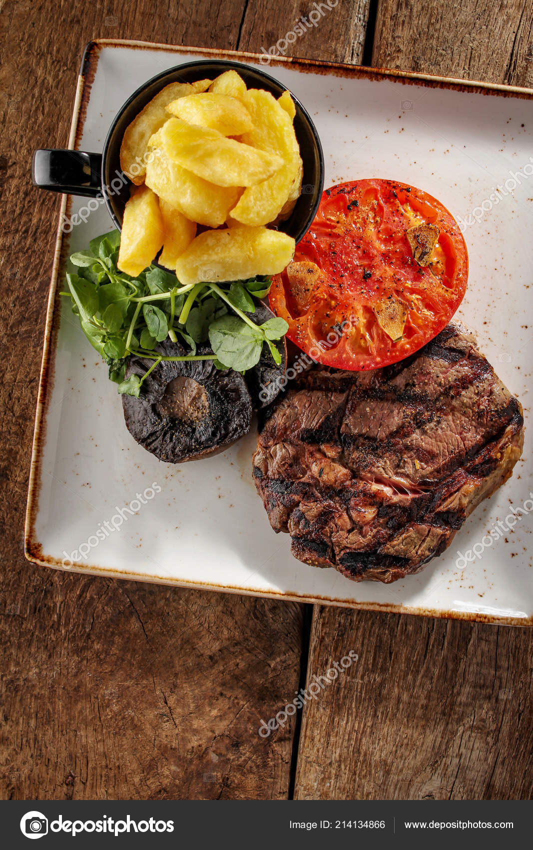 Plated Ribeye Steak Dinner Stock Photo by ©neillangan 214134866