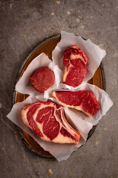 aged cut beef steaks on the table