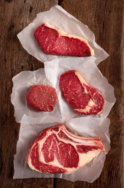 aged cut beef steaks on the table