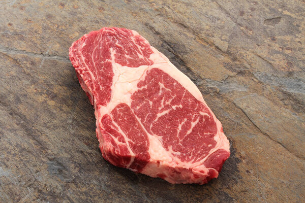 aged beef steak cut on the table