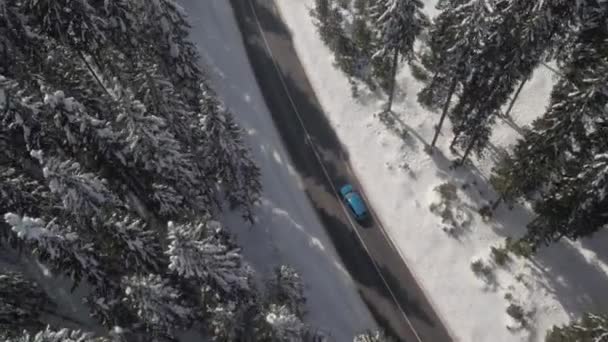 Aerial Flying Turquoise Sports Car Driving Narrow Highway Deep Snowy — Stock Video