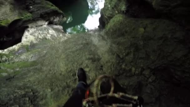 Pov Unrecognizable Climbing Mossy Dangerous Mountain Cliff Jumping Ledge Refreshing — стоковое видео