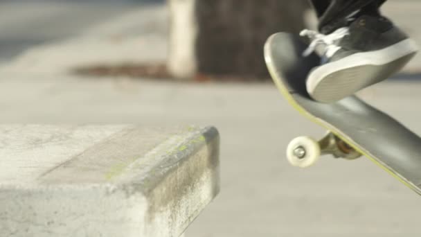 Slow Motion Close Dof Unrecognizable Skateboarder Jumping Sliding Concrete Bench — Stock Video
