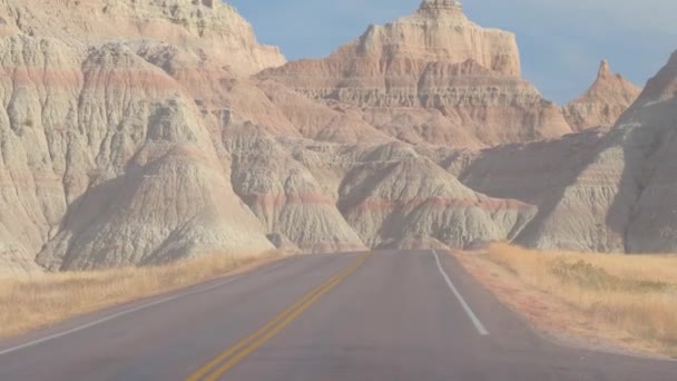 Fpv Driving Dusty Road Picturesque Badlands Landscape Rocky Sandstone Formations — Stock Video