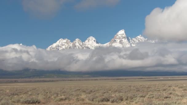 Aerial Majestic Grand Teton Mountain Peaks Raising Foggy Clouds Dry — Stock Video