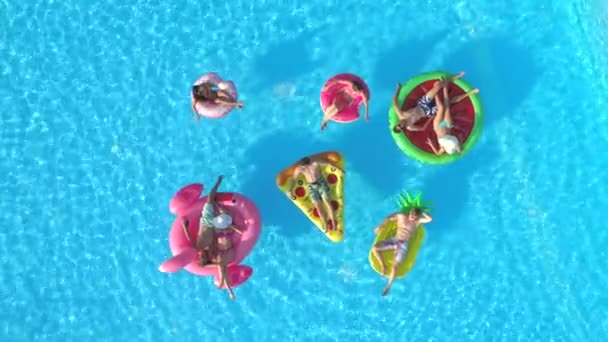 Aerial Top Relaxed Girls Guys Laying Colourful Floaties Pool Happy — Stock Video