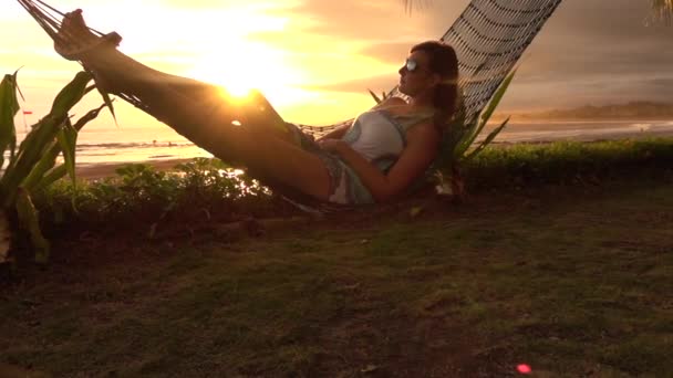 Slow Motion Pensive Young Woman Vacation Laying Resting Hammock Golden — Stock Video