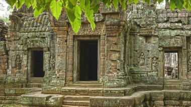 Angkor Wat temple in Cambodia. Sacred stone temple complex dedicated to Hindu god Vishnu located in Cambodia, Asia. Stunning ancient architecture surrounded by lush greenery and intricate detail.
