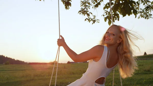 Lens Flare Close Setting Sun Glowing Happy Girl Swaying Rope Stock Photo