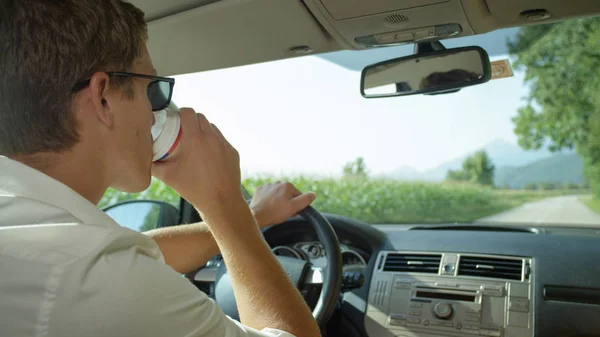 Close Young Man Drinking Fresh Cup Coffee While Driving Picturesque — Stock Photo, Image