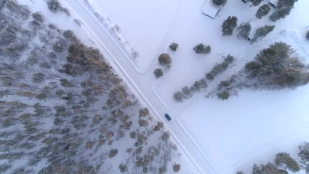 Aerial Top Blue Car Driving Snowy Road Rural Houses Frosty — Stock Video