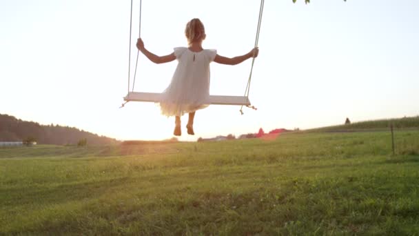 Slow Motion Close Unrecognizable Little Girl Swaying Wooden Swing Warm — Stock Video