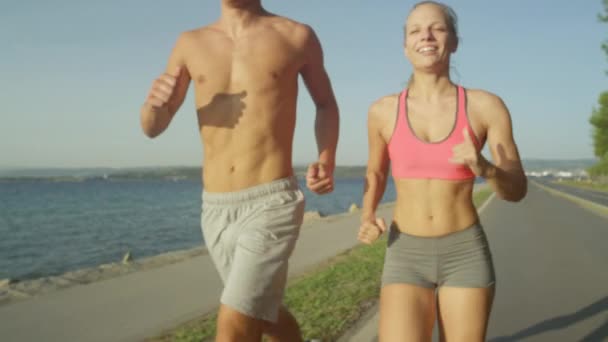 Young Boyfriend Girlfriend Jogging Together Sunny Seaside Active Man Woman — Stock Video